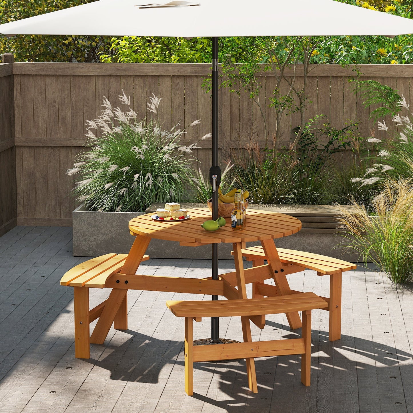 6-Person Round Picnic Table Set with 3 Built-in Benches and Umbrella Hole-Yellow in garden setting