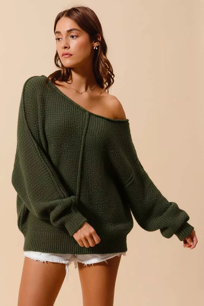 Model wearing SO ME Loose Fit Exposed Seam Slouchy Boucle Sweater in olive green