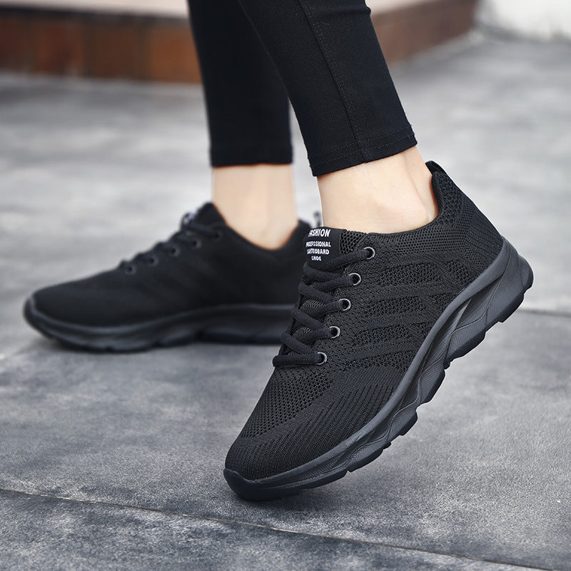 Women’s Mesh Running & Travel Sneakers in black, showcasing breathable mesh design and cushioned soles for comfort and versatility.