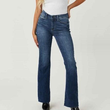 Woman wearing High Waist Slim Fit Stonewashed Jeans – The Perfect Cowgirl Fit, showcasing dark blue denim and slim silhouette.