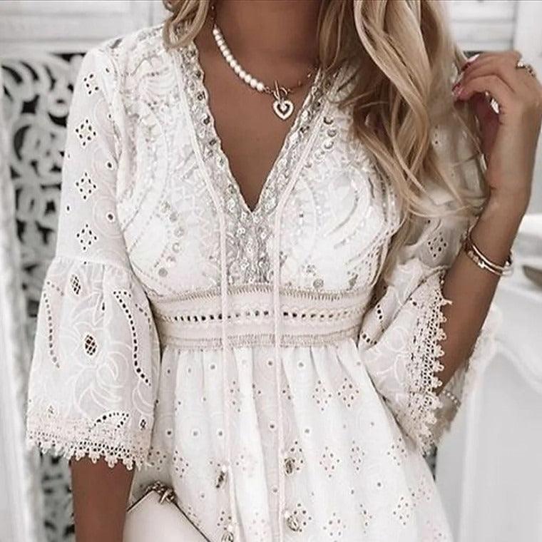 Woman wearing Lace Embroidered Romance Dress - Sweet and Fresh Floral Cotton Dress for Women with delicate embroidery and ruffle sleeves.