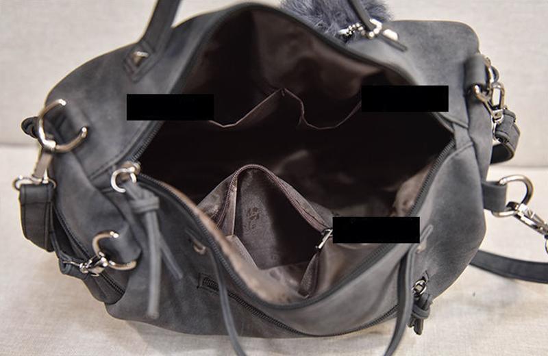 Interior view of the Rustic Charm Leather Shoulder Bag – Stylish Cowgirl Handbag, showcasing its spacious design with multiple compartments.