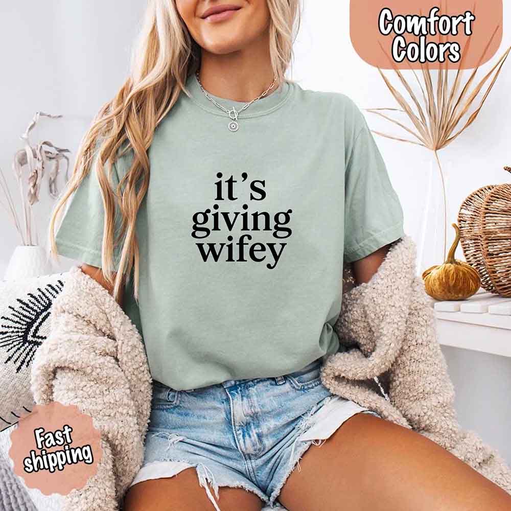 Woman wearing Its Giving Wifey Comfort Colors Tee, bridal gift shirt with chic style and comfort.