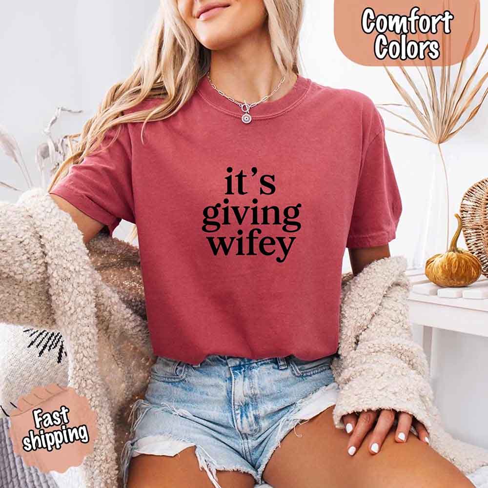 Woman wearing Its Giving Wifey Comfort Colors Tee, a perfect bride shirt with stylish design, soft fabric, and bridal vibes for weddings.