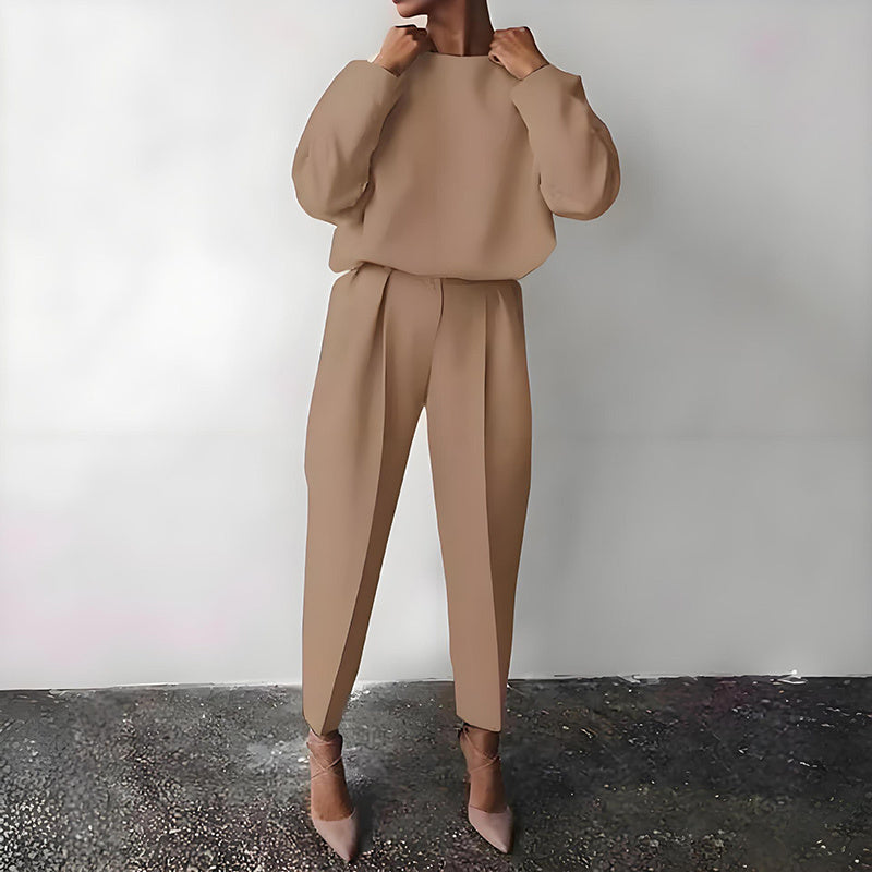 Model wearing Women’s Solid Color 2-Piece Set – Long Sleeve Top & Pleated Pants Loungewear in beige, showcasing stylish design.