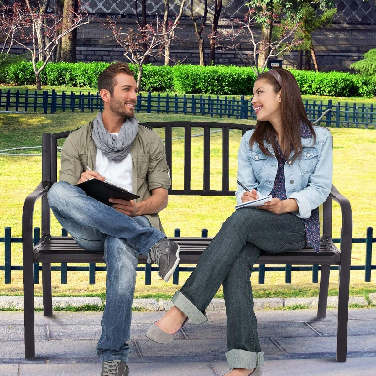 Couple sitting on 50 Inch Patio Garden Bench Loveseats for Outdoor in a park setting.