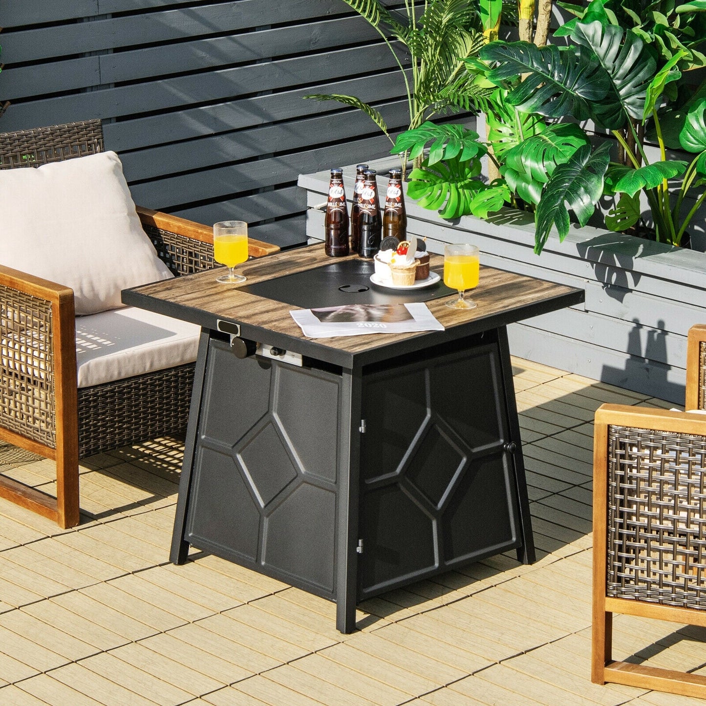 40 000 BTU 28 Inches Propane Gas Fire Pit Table With Cover on patio with seating and refreshments