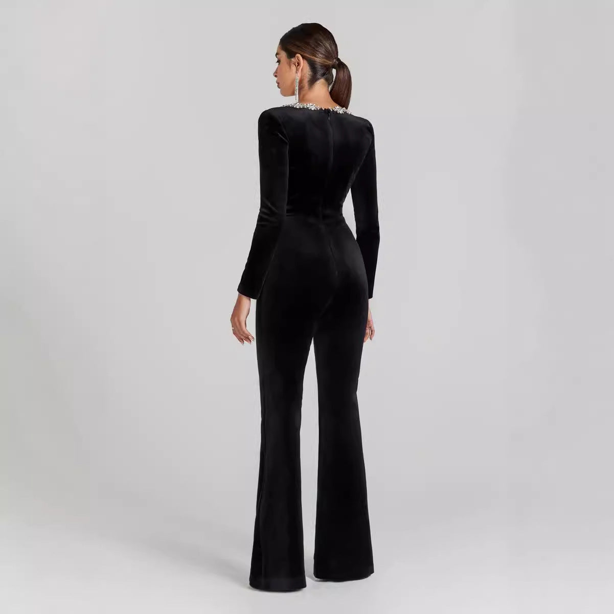 Back view of Women’s Diamond-Encrusted Square-Collar Flared Jumpsuit in black, showcasing elegant flared legs and luxurious design.