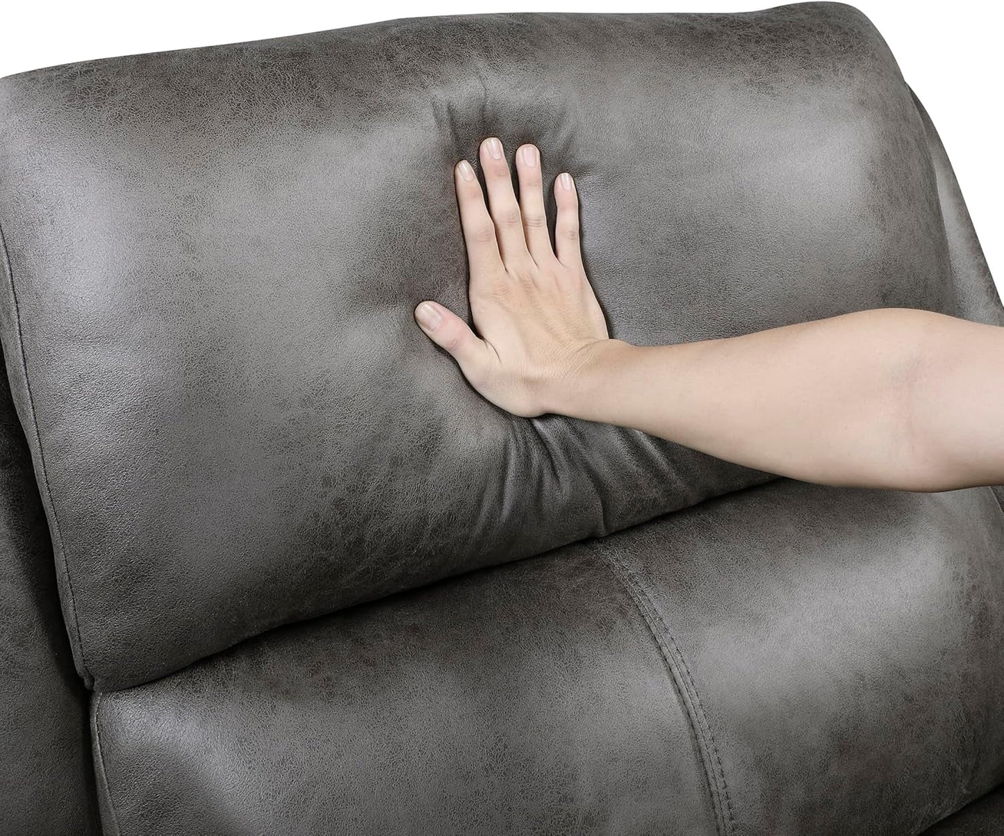 Hand pressing cushion on Grey Rocker Recliner Chair With Manual Recline Living Room, showing plush comfort and waterfall back design.
