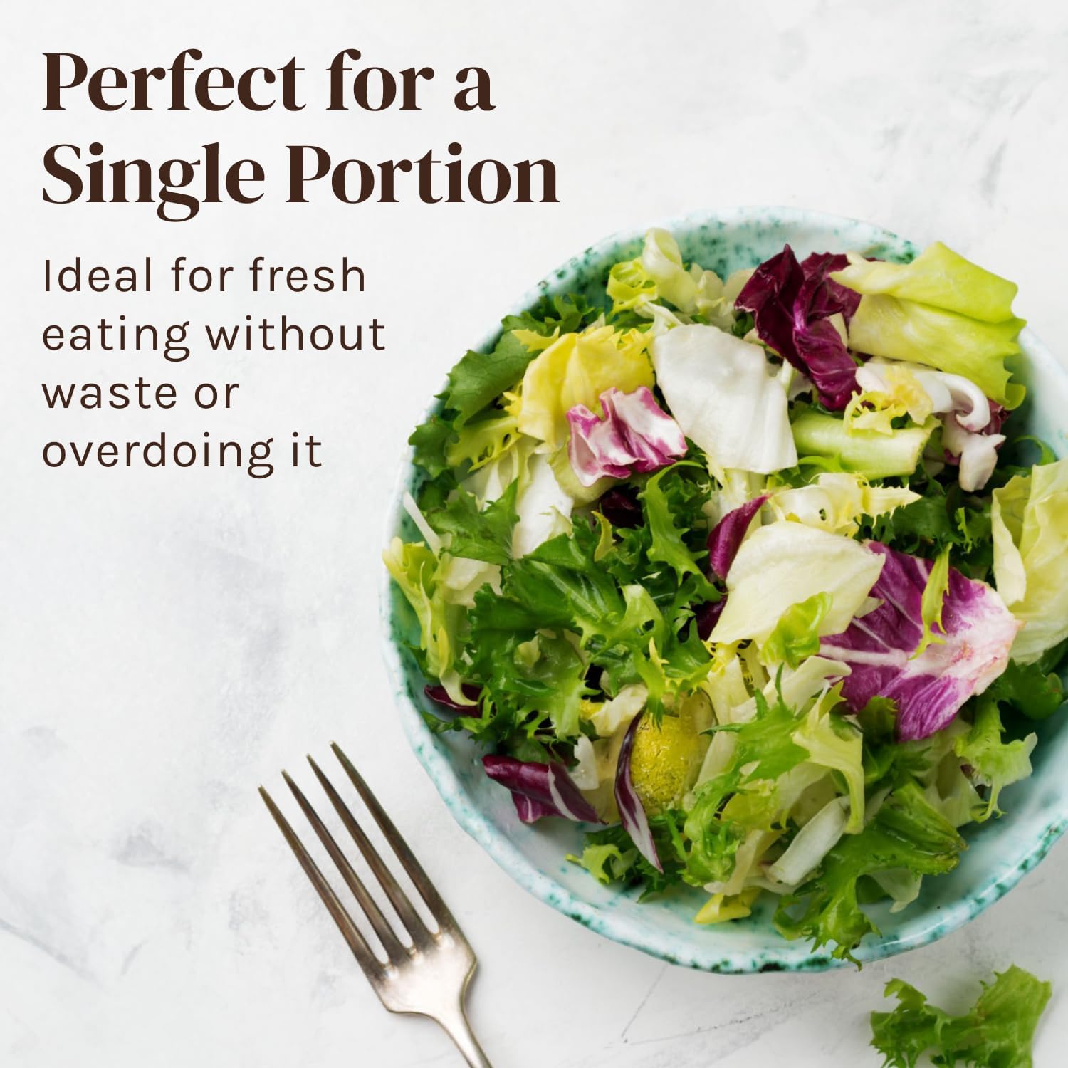 Mini Salad Spinner and Dryer With Measuring Cup Bowl, Best Rated Lettuce Spinners Single Serve, Collander with Spinner, Vegetable Washing Basket - Image of fresh salad in a green bowl with a fork.