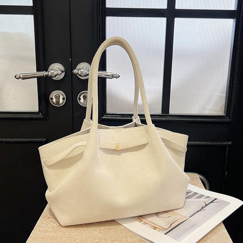 Cowgirl Suede Tote Bag – Stylish and Practical Western Handbag in soft suede, showcasing rustic elegance and spacious design on table.