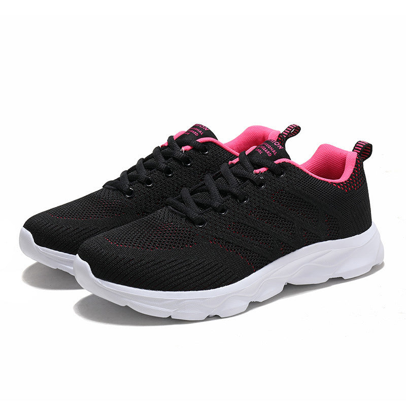 Women’s Mesh Running & Travel Sneakers in black with pink accents, featuring breathable mesh uppers and cushioned soles for comfort.
