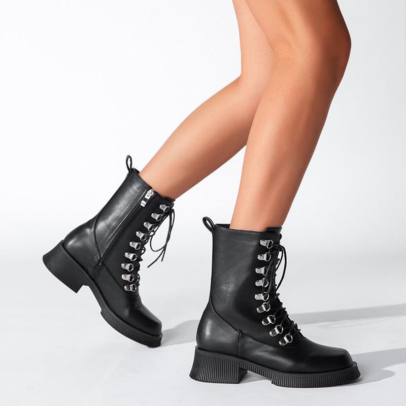 Black Knight Lace-Up Boots showcasing mid-calf design and silver eyelets in high-quality simulated leather for bold style.