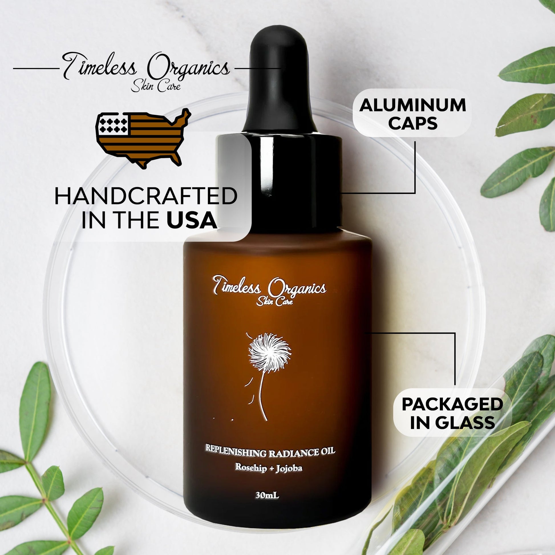 Replenishing Radiance Oil in glass bottle with aluminum cap, handcrafted in the USA, surrounded by green leaves.