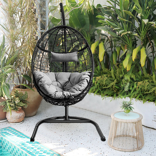 Hanging Cushioned Hammock Chair with Stand -Gray in a lush garden near pool, featuring soft pillow and cushion for comfort.