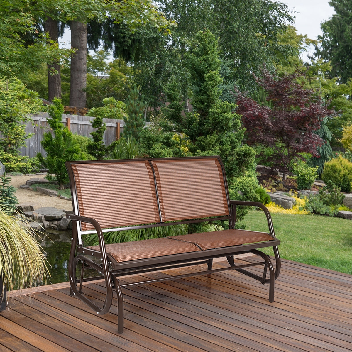 Swing Glider Chair 48 Inch Loveseat Rocker Lounge Backyard-Brown on wooden deck with lush garden