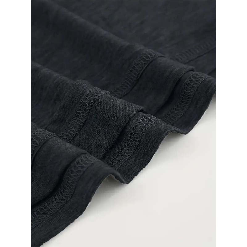 Hem detail of Women's Bohemian Moon And Tree Graphic Tee showing reinforced stitching and premium fabric blend for durability.