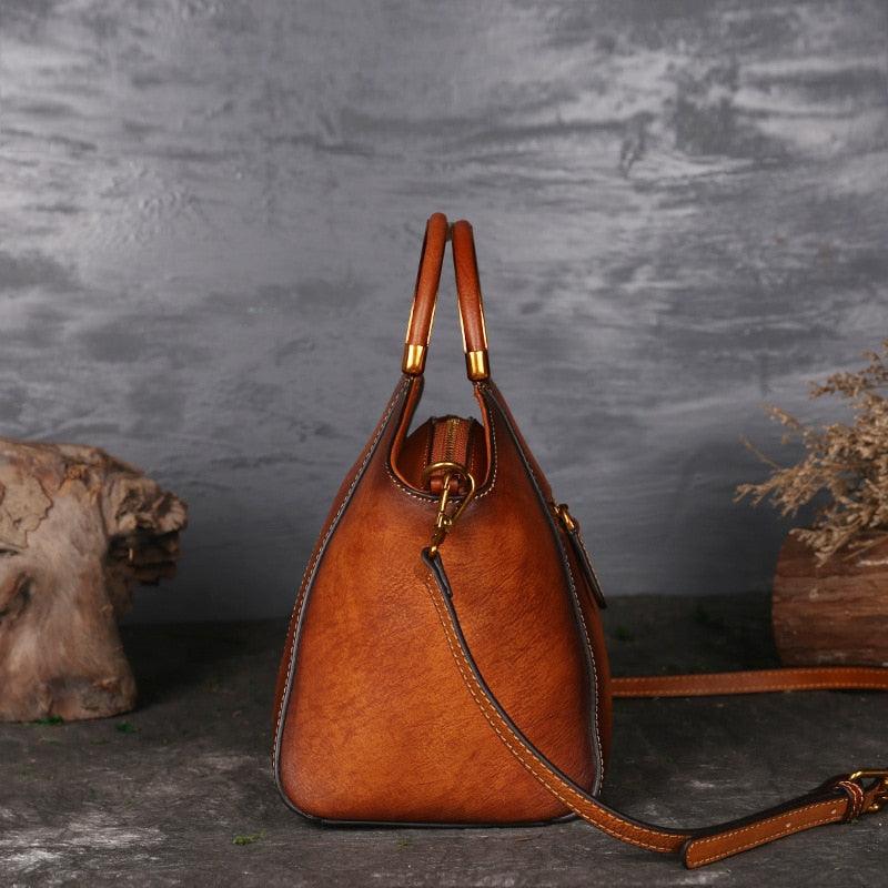 Side view of Mandala Embossed Leather Shoulder Bag showcasing craftsmanship and quality materials on a rustic background.