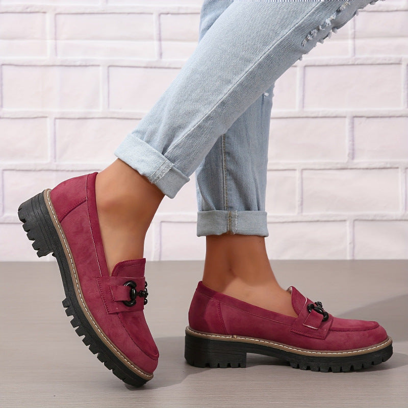 Women’s Horsebit Loafers – Elegant Flat Loafers for Work & Casual Wear in red with metal detail, paired with jeans against a brick wall