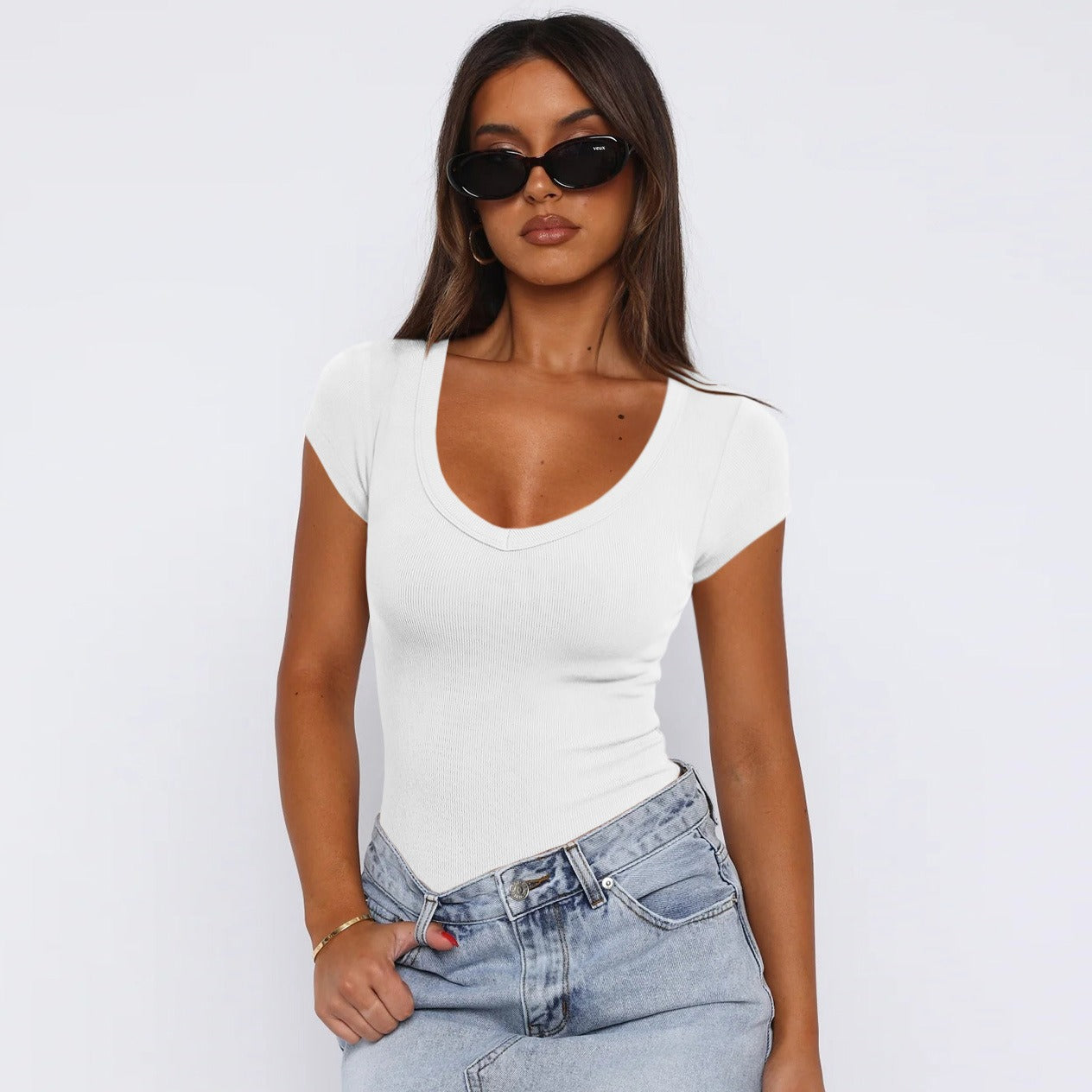 Model wearing Saddle Ridge Everyday Tee in Off-White, styled with jeans, showcasing the versatile and comfortable fit.