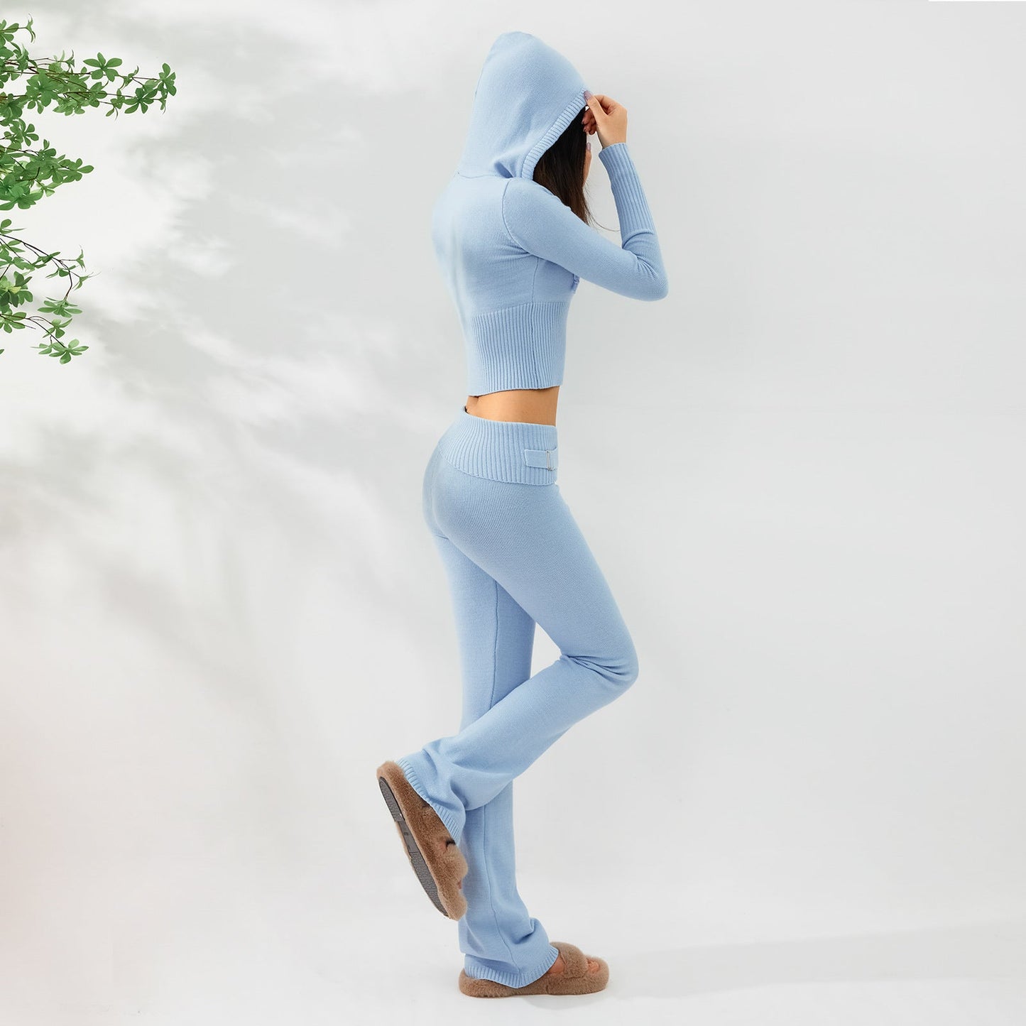 Woman modeling a blue Women's Knitted Hooded Two-Piece Set – Cardigan & High-Waisted Pants Suit for a stylish casual look.