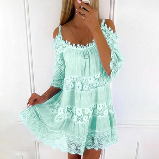 Woman wearing Lace Embrace Summer Sling Dress with delicate lace and flying sleeves, perfect for sunny days and romantic evenings.