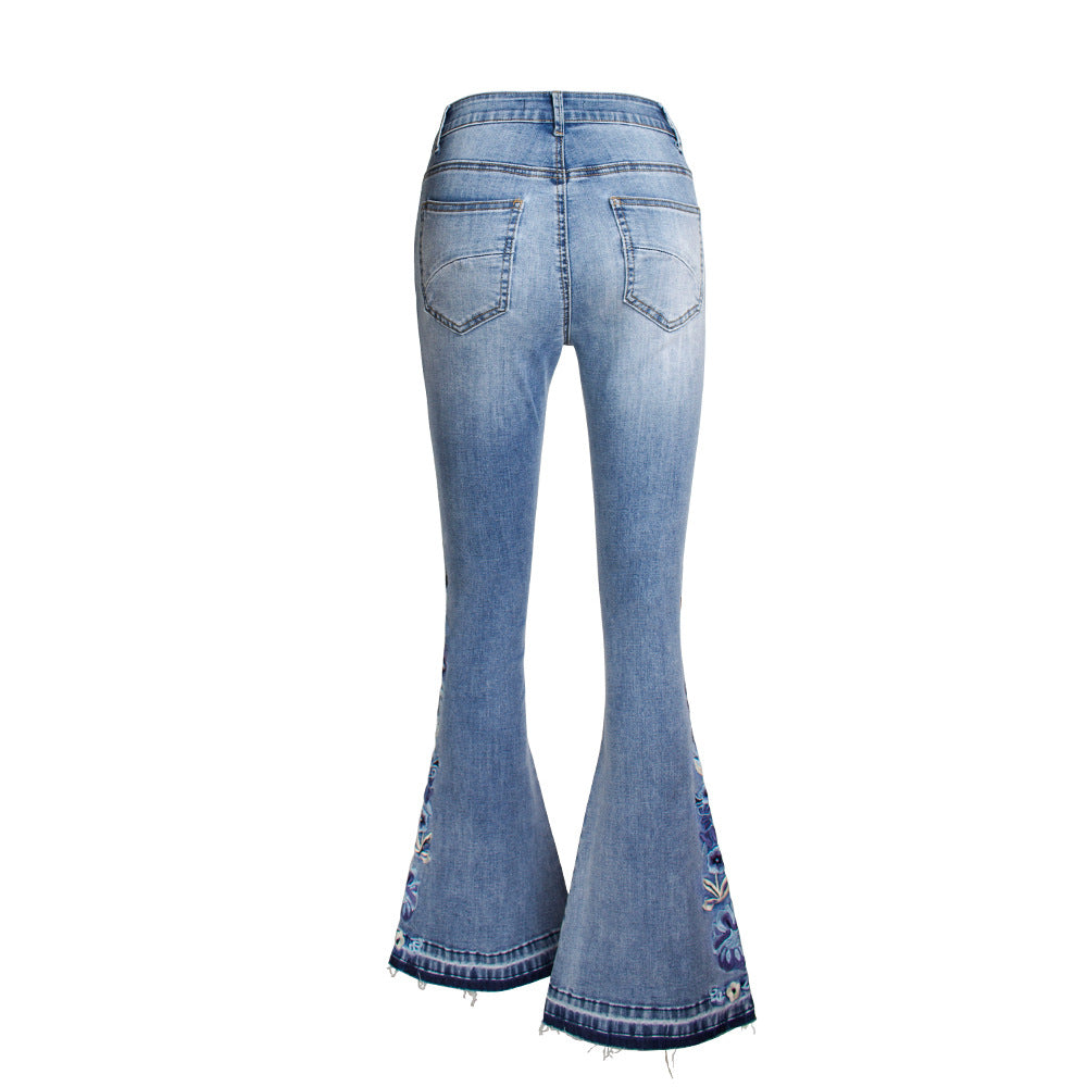 Back view of light blue "Riley" Flared Denim Jeans with embroidered details, showcasing vintage washed effect and mid-waist fit.