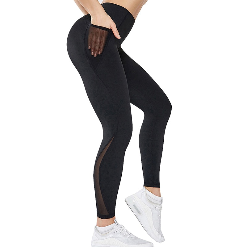 Person wearing Yoga Leggings with Phone Pocket, featuring mesh details and side pocket while exercising.