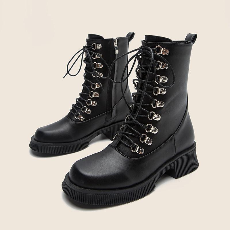 Black Knight Lace-Up Boots with silver-plated eyelets and thick black soles on a neutral background, perfect for bold stylish impressions.