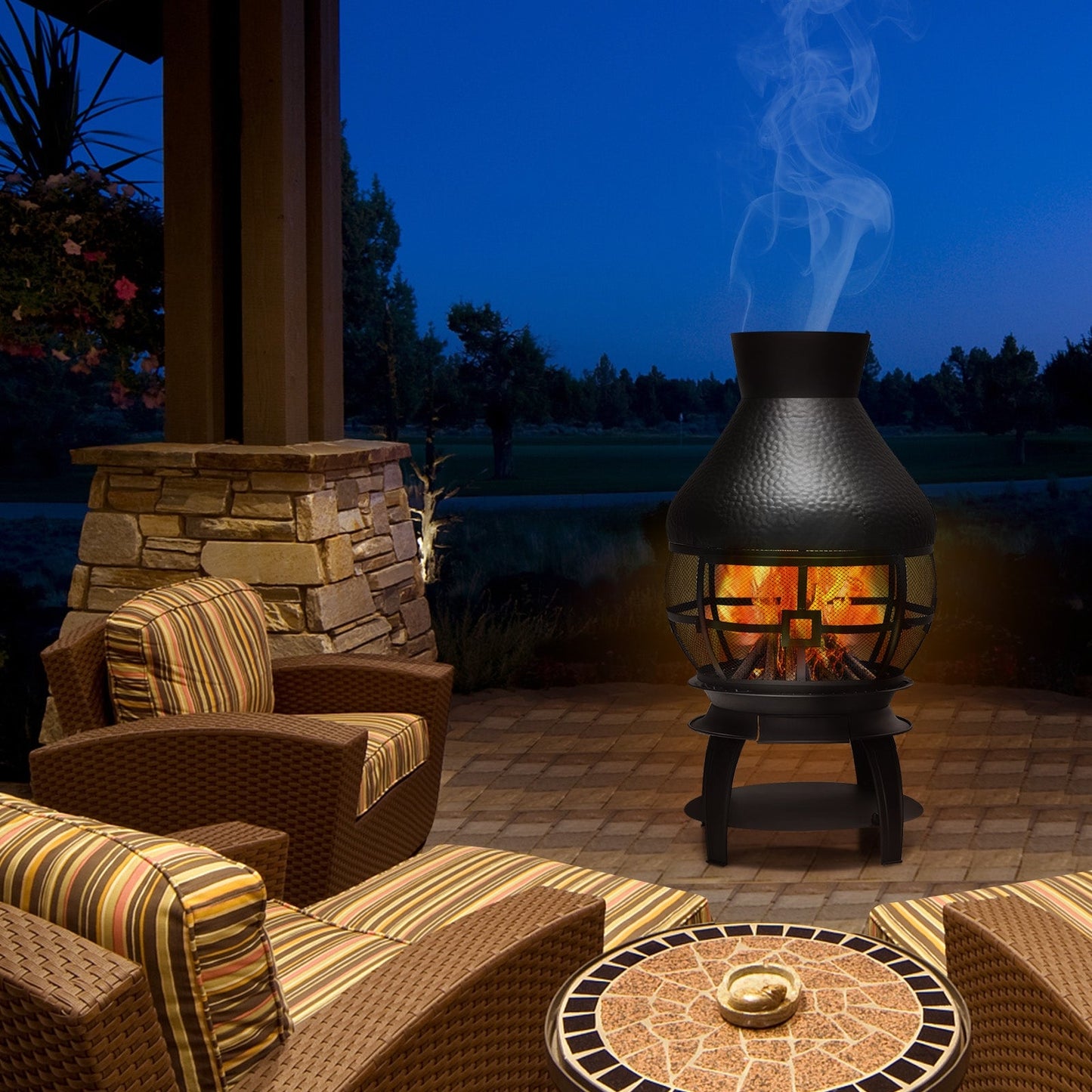 Patio Wood Burning Chimneys Fireplace with cast iron build on outdoor deck at night