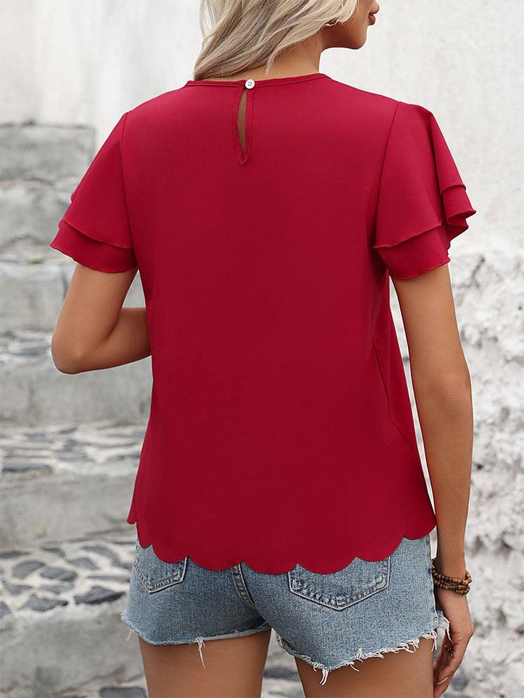 Back view of Lotus Blossom Ruffle Top - Stylish Red Double-layer Lotus Leaf Sleeve Blouse with scalloped waist, paired with denim shorts.