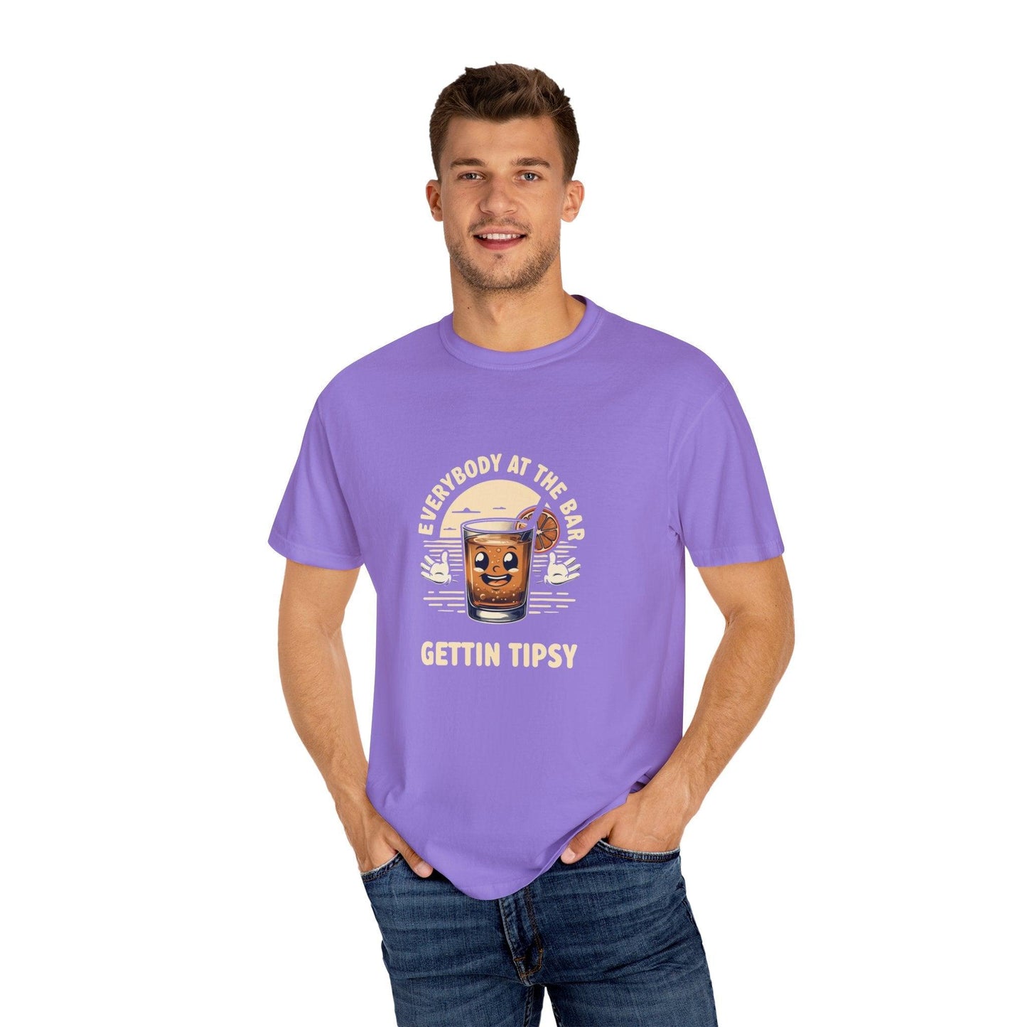 Man wearing Everyone at the Bar Gettin Tipsy Unisex Garment-Dyed T-Shirt with whiskey glass graphic and playful text.