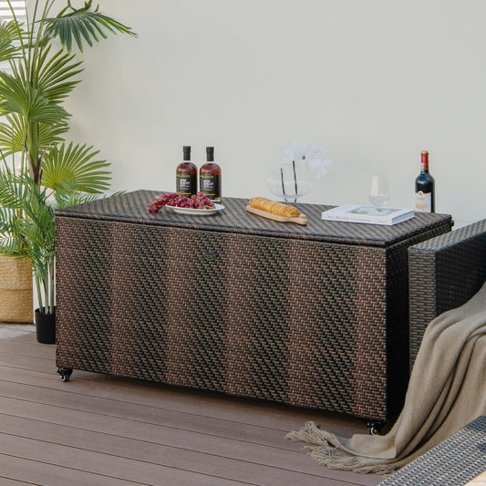 96 Gallon PE Wicker Outdoor Storage Box with 4 Wheels-Brown on a patio, styled with drinks and decor, showing its large capacity.