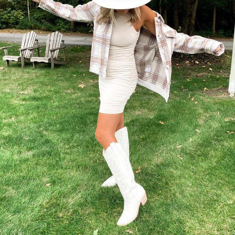 Embroidered Western Cowboy Knee-High Boots - Stylish Cowgirl Chic, worn with a chic outfit on a grassy lawn.