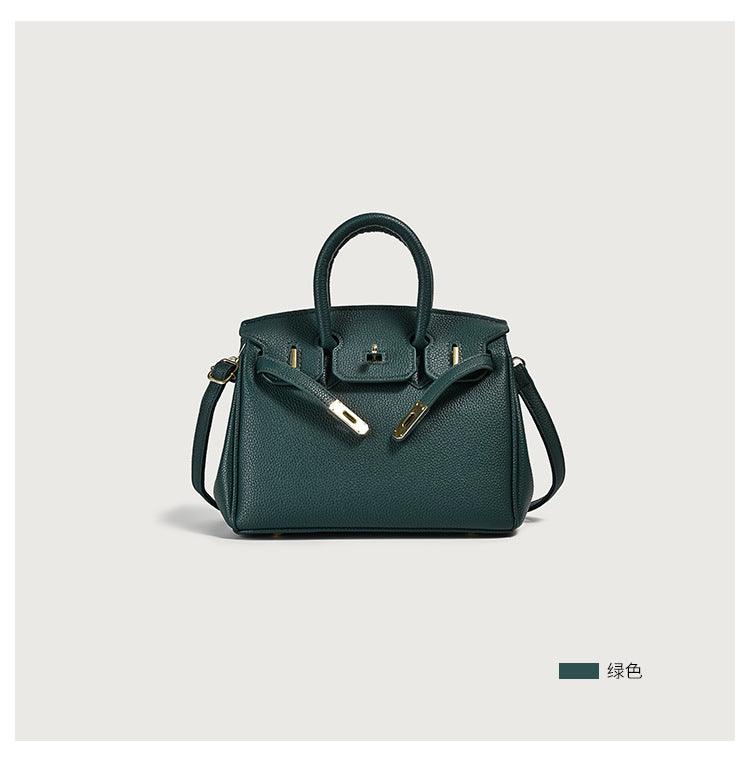 Stylish green leather handbag with gold accents, featuring a spacious compartment and elegant design suitable for daily use.
