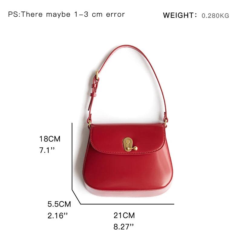 Red handbag with measurements and weight displayed, showing a detailed view of size and design.
