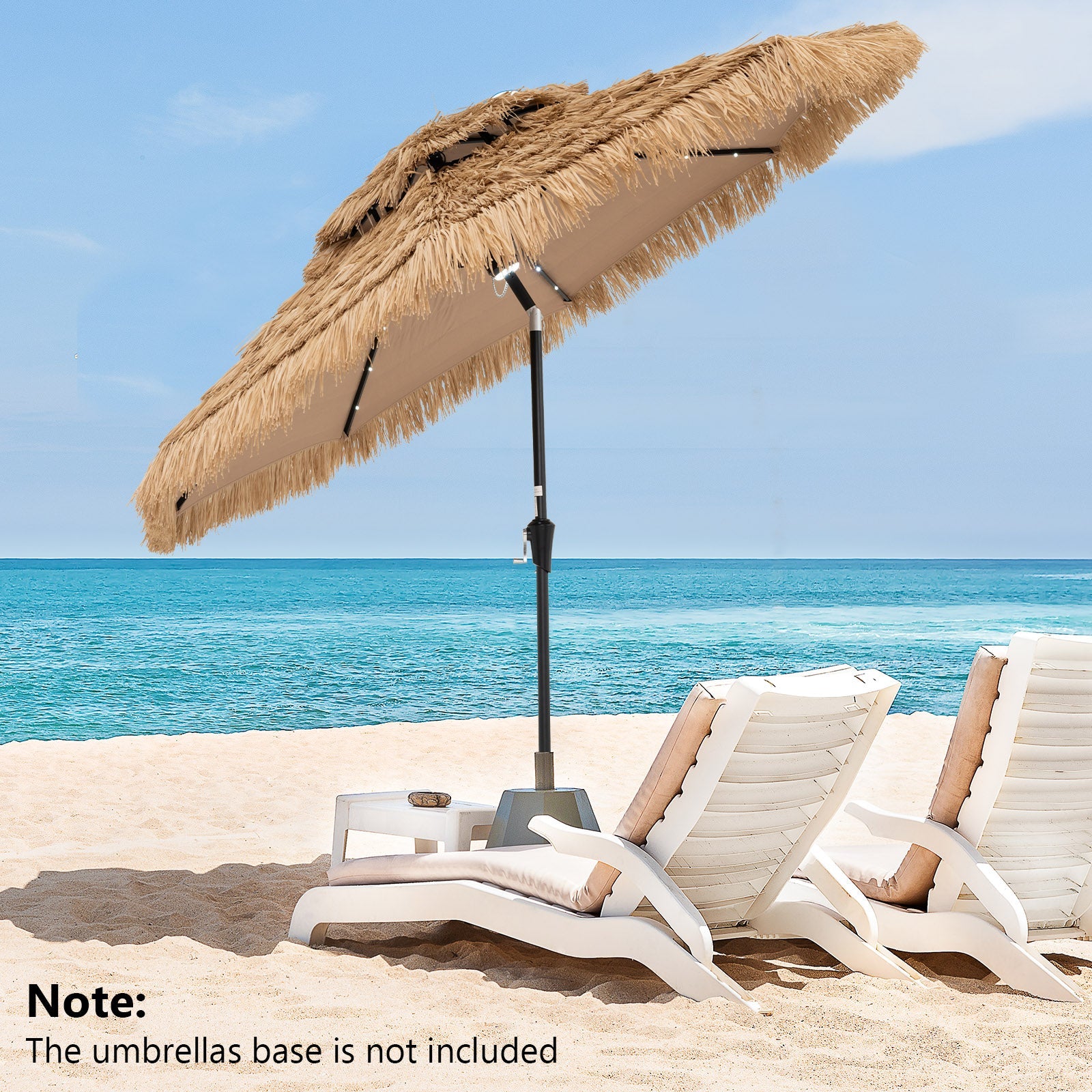 9 Feet Solar Powered Thatched Tiki Patio Umbrella with Led Lights on a beach with sun loungers, ocean view in the background