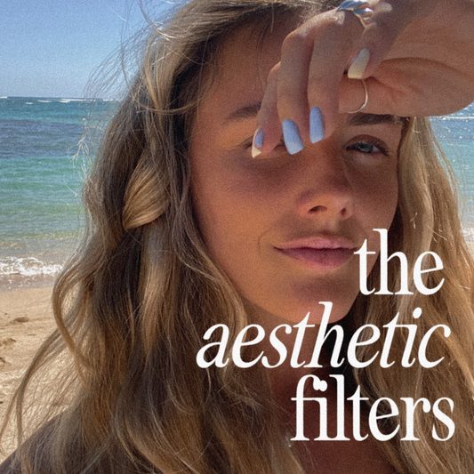 Woman on a beach using the aesthetic filters for a subtle no makeup look with vibey presets for Instagram in Adobe Lightroom Mobile.