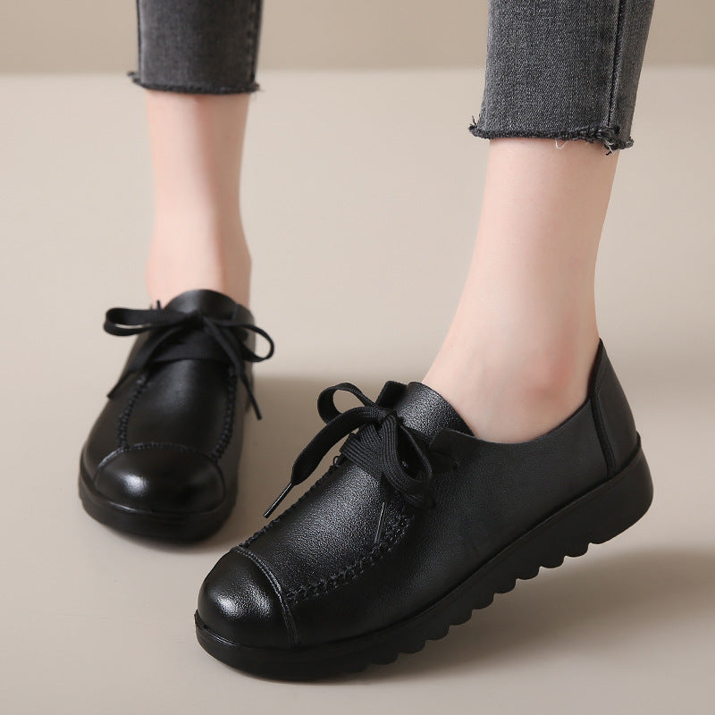 Women’s Black Flat Work Shoes – Soft Sole Anti-Slip Flats worn by person in grey denim.