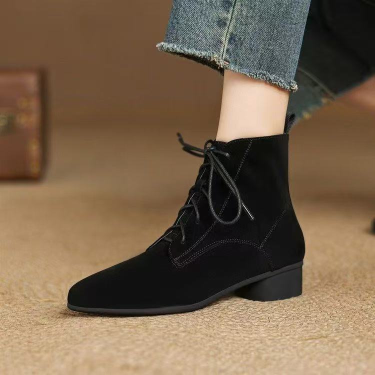 Woman wearing Maillard Matte Pointed Low-Heel Ankle Boots Women, black matte finish, pointed toe, low heel, stylish and comfortable.