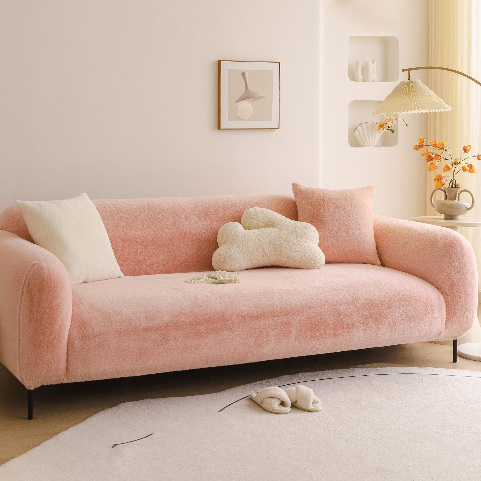 Soft Plush Warm Sofa Cover Stretchable Cozy Velvet Couch Protector for Fall & Winter on a stylish pink sofa with pillows in a living room.