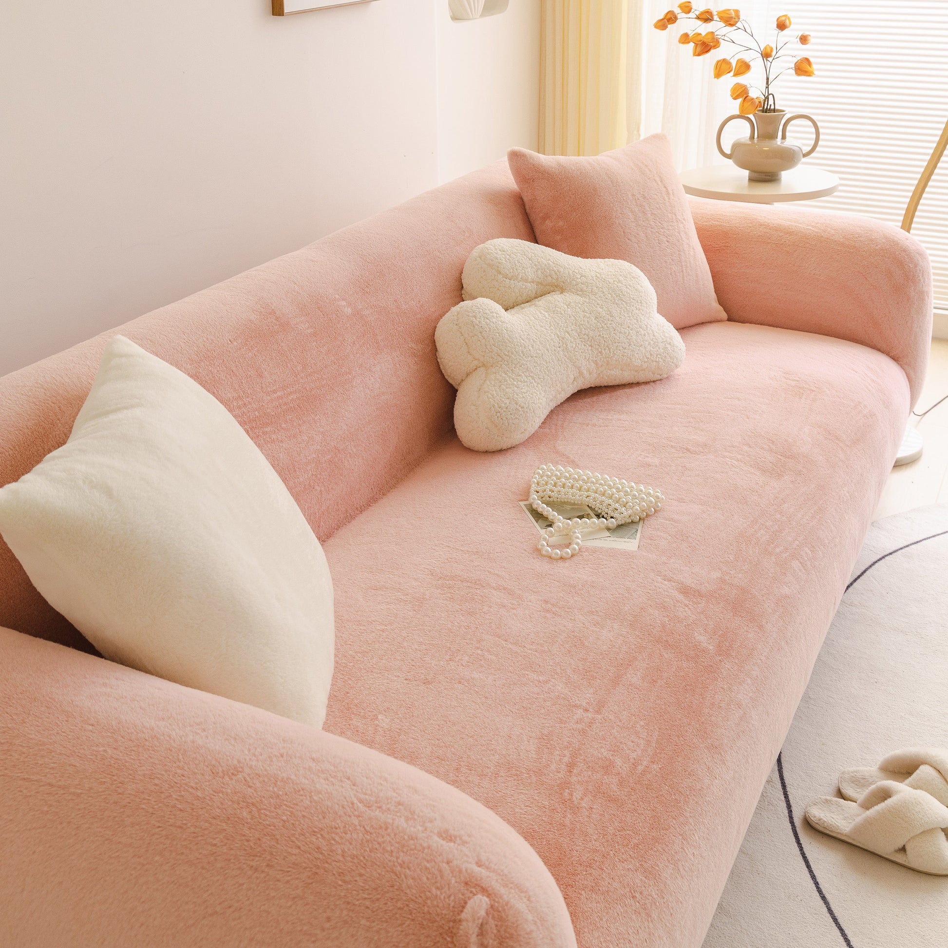 Soft Plush Warm Sofa Cover Stretchable Cozy Velvet Couch Protector for Fall & Winter in soft pink on a sofa with pillows