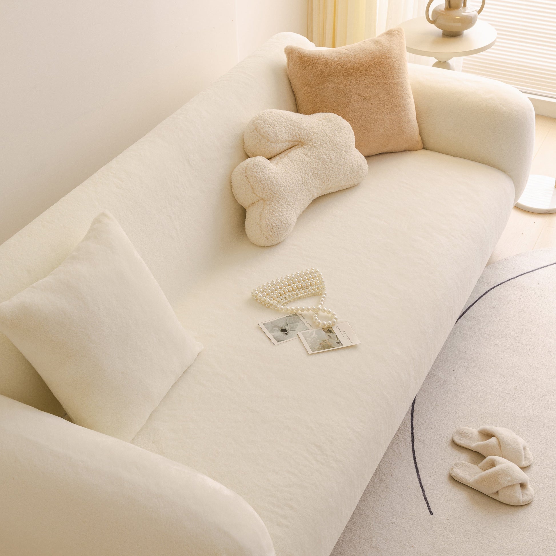 Soft Plush Warm Sofa Cover Stretchable Cozy Velvet Couch Protector for Fall & Winter on a cream-colored sofa with decorative pillows.