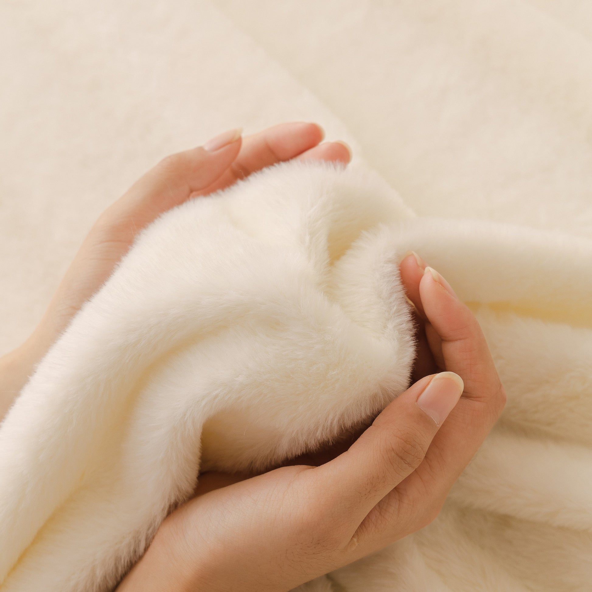 Hands touching Soft Plush Warm Sofa Cover Stretchable Cozy Velvet Couch Protector for Fall & Winter, showcasing its plush texture.