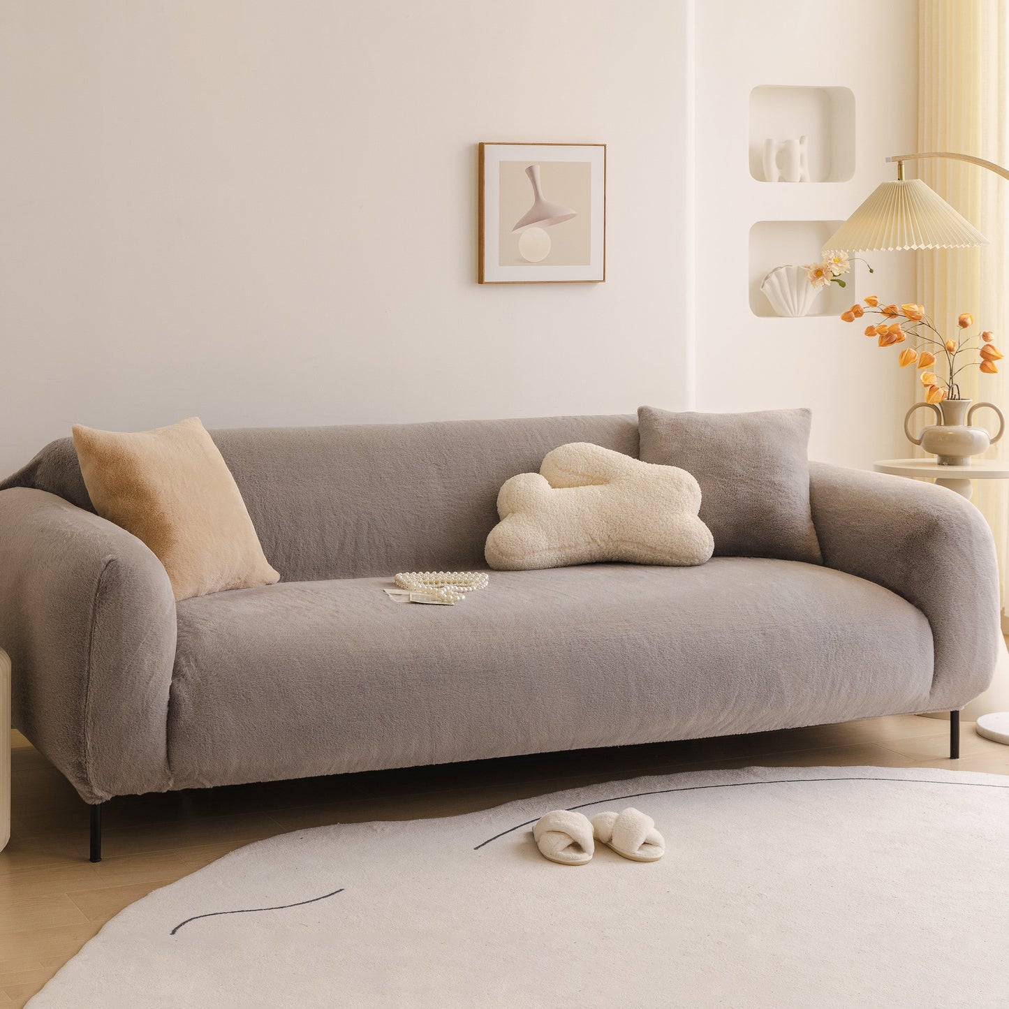 Modern living room with Soft Plush Warm Sofa Cover Stretchable Cozy Velvet Couch Protector for Fall & Winter on grey sofa.