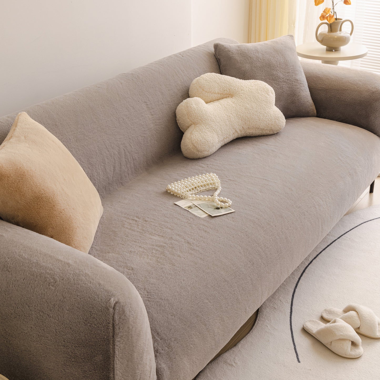 Soft Plush Warm Sofa Cover Stretchable Cozy Velvet Couch Protector for Fall & Winter on a grey sofa with decorative pillows
