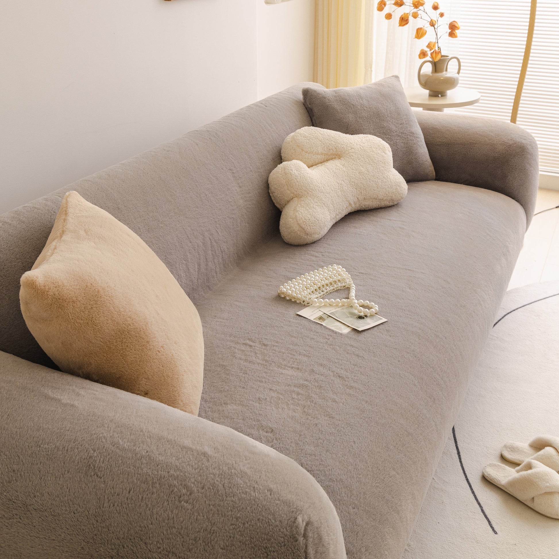 Soft Plush Warm Sofa Cover Stretchable Cozy Velvet Couch Protector for Fall & Winter on a modern living room sofa.