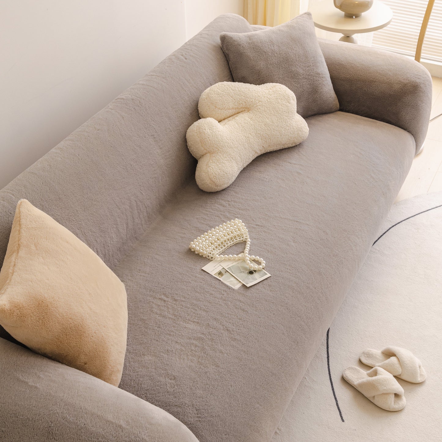 Soft Plush Warm Sofa Cover Stretchable Cozy Velvet Couch Protector for Fall & Winter on a gray sofa with cushions and decor.