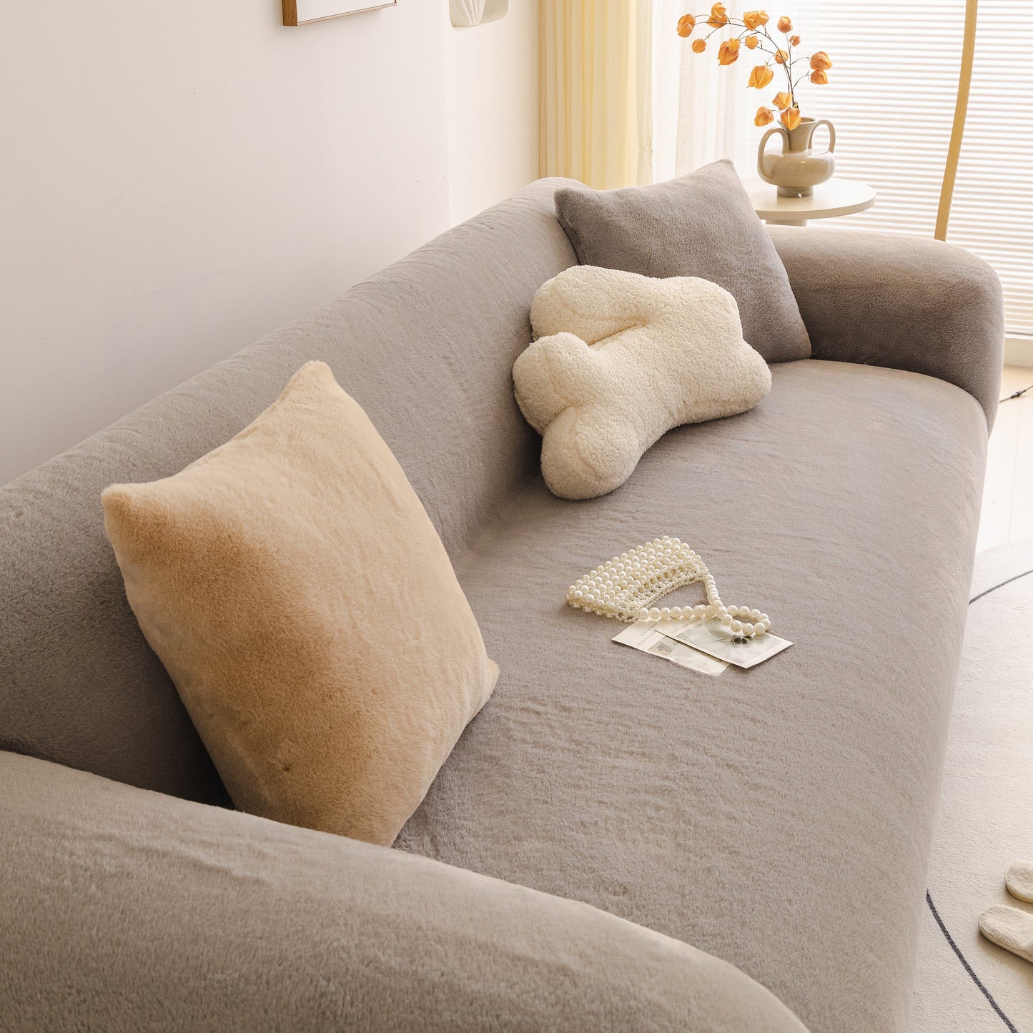 Soft Plush Warm Sofa Cover Stretchable Cozy Velvet Couch Protector for Fall & Winter on gray sofa with decorative pillows.