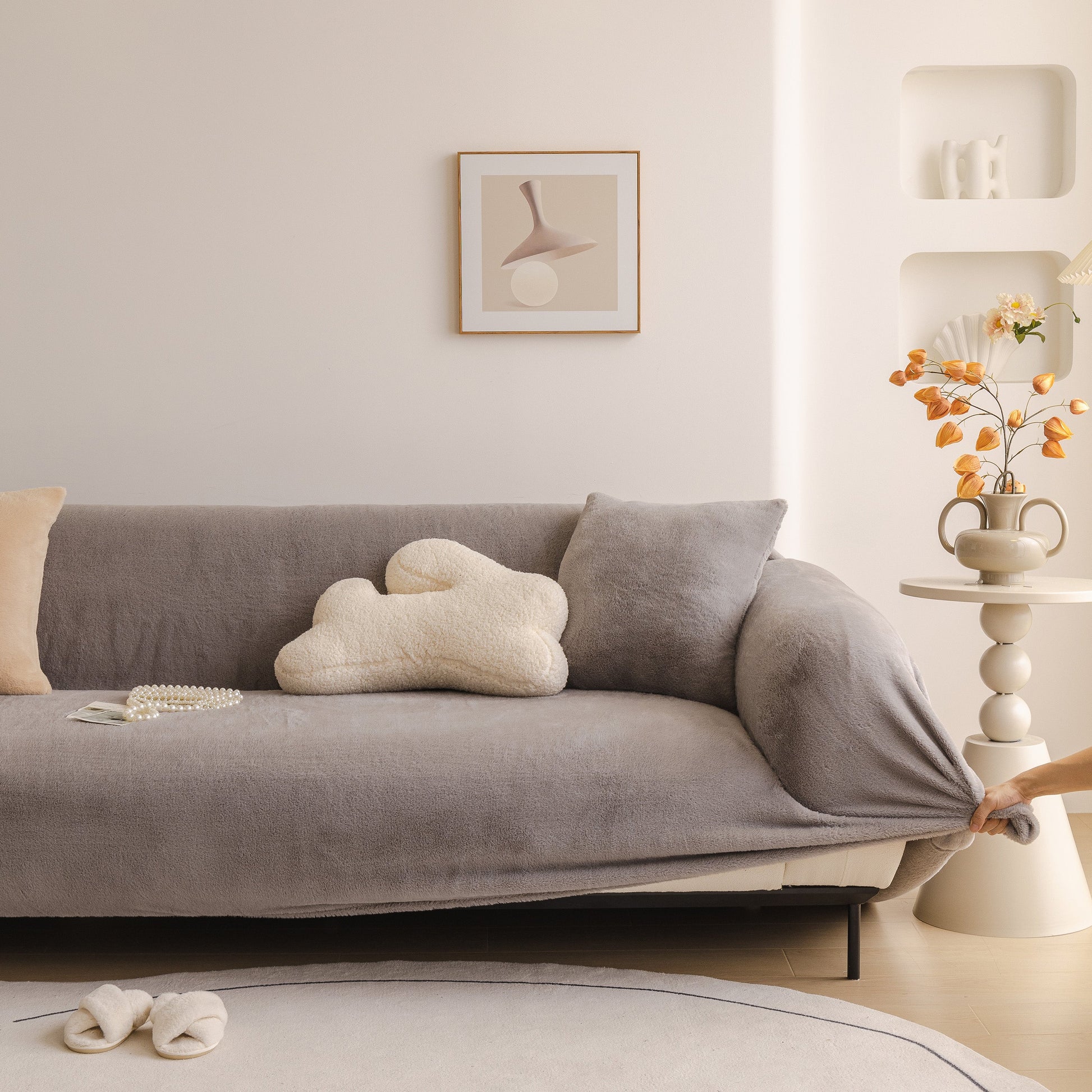 Soft Plush Warm Sofa Cover Stretchable Cozy Velvet Couch Protector for Fall & Winter draped over a modern grey sofa.